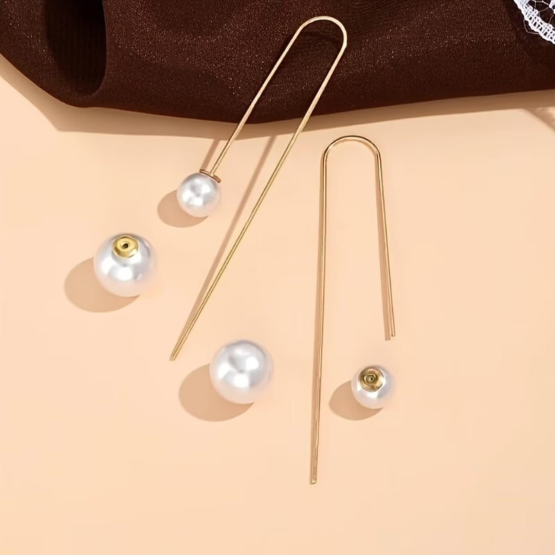 Statement oorbellen met stralende parel