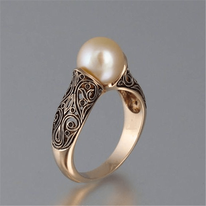 Tijdloze vintage ring met parels in goud