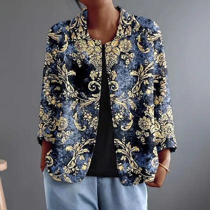 Nolwen elegante avondblouse met gouden ornament op indigo