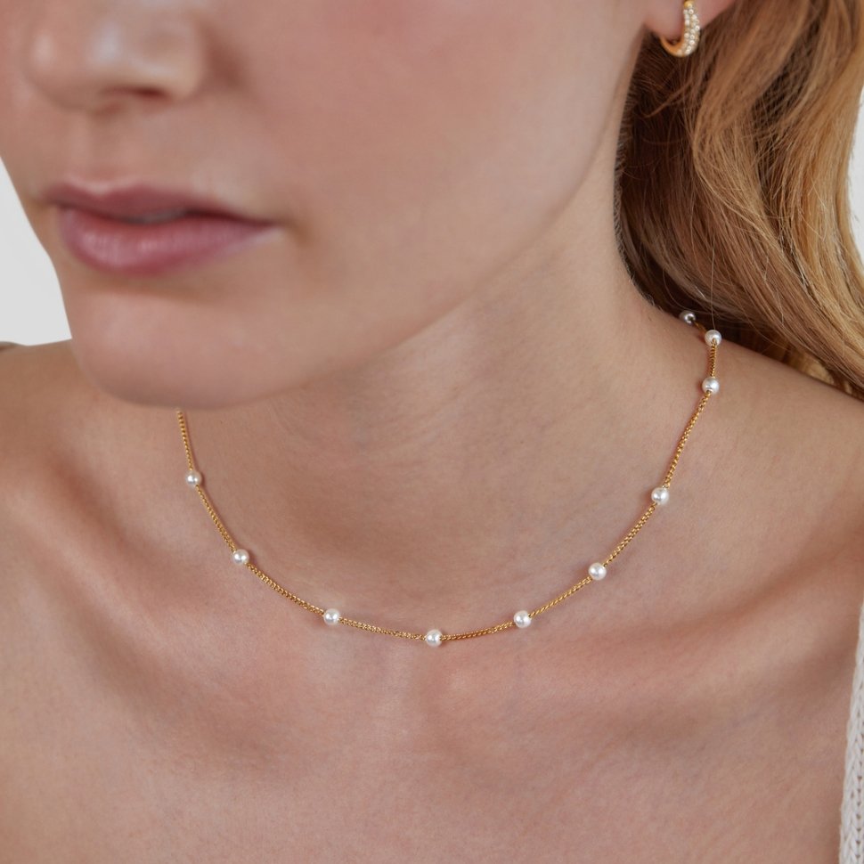 Tijdloze ketting met gouden parels