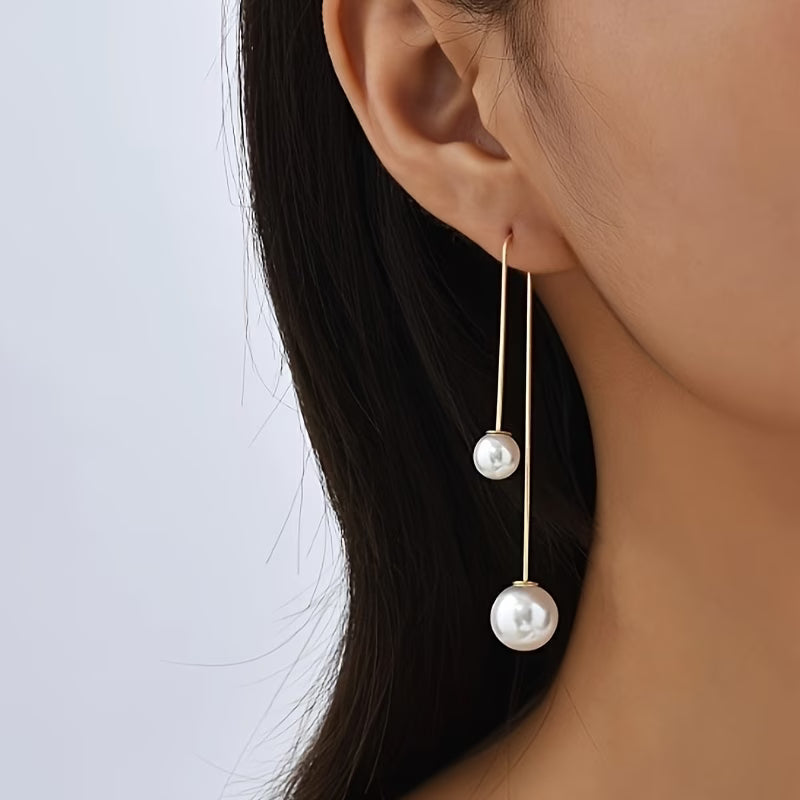 Statement oorbellen met stralende parel