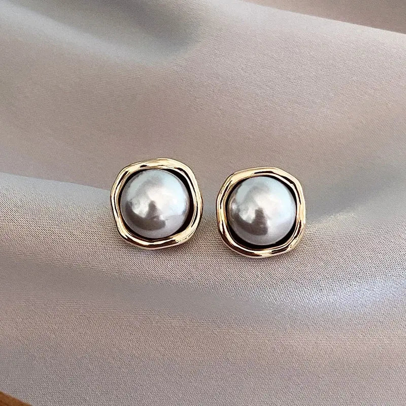 Luxe oorbellen met zwarte parel