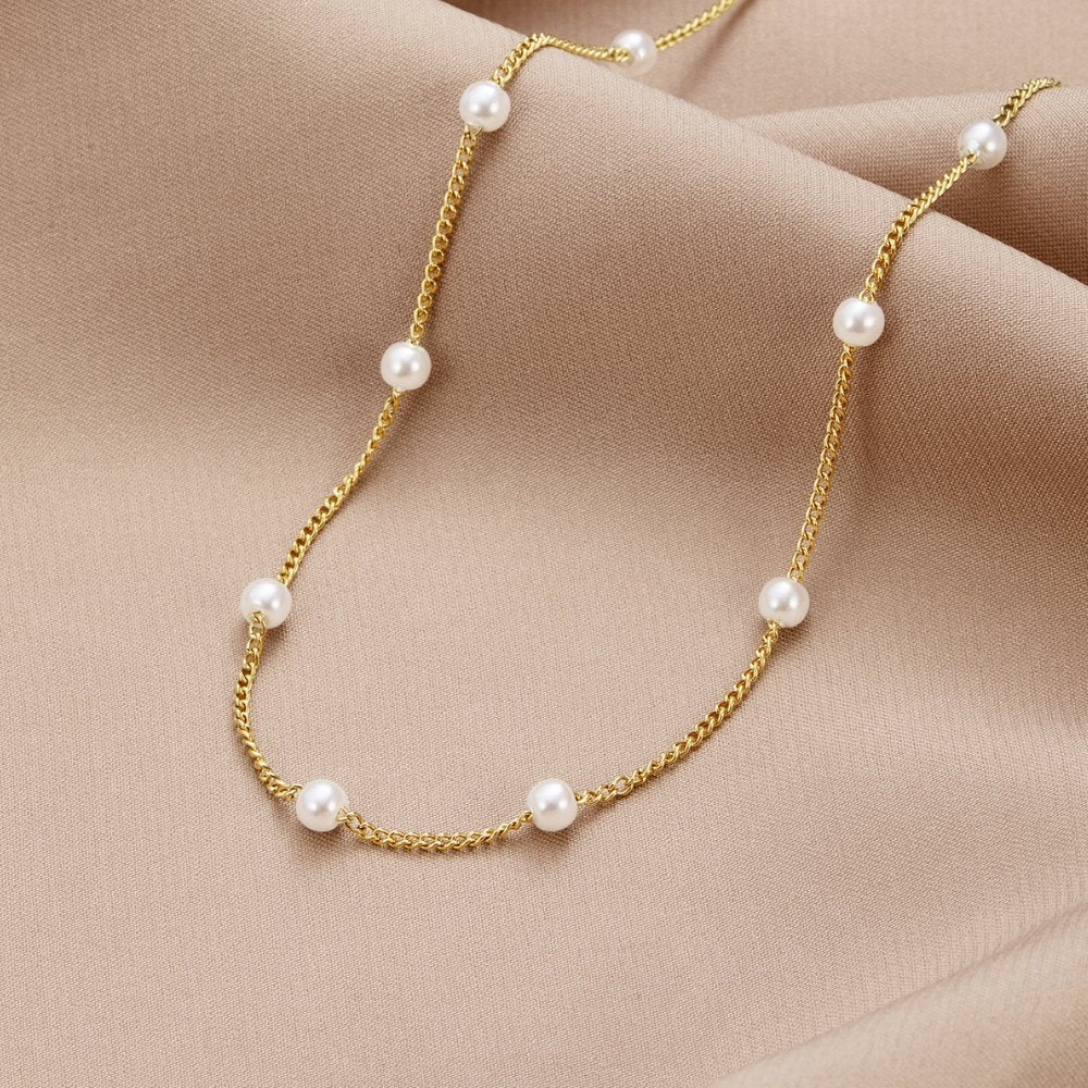 Tijdloze ketting met gouden parels