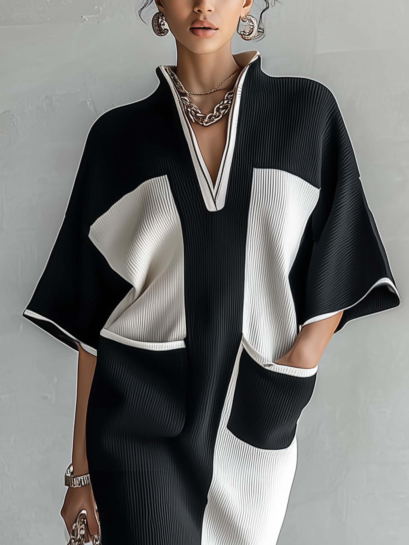 Zwart-witte midi-jurk in colorblock met vleermuismouwen