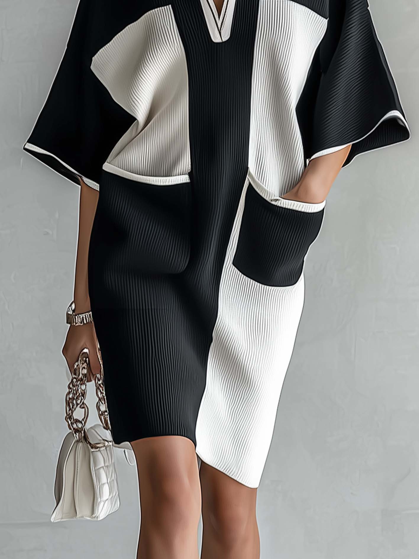 Zwart-witte midi-jurk in colorblock met vleermuismouwen